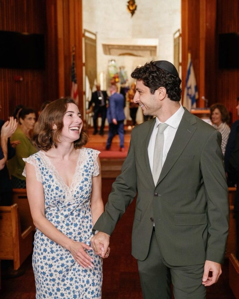 Couple celebrating their wedding at Temple Sinai