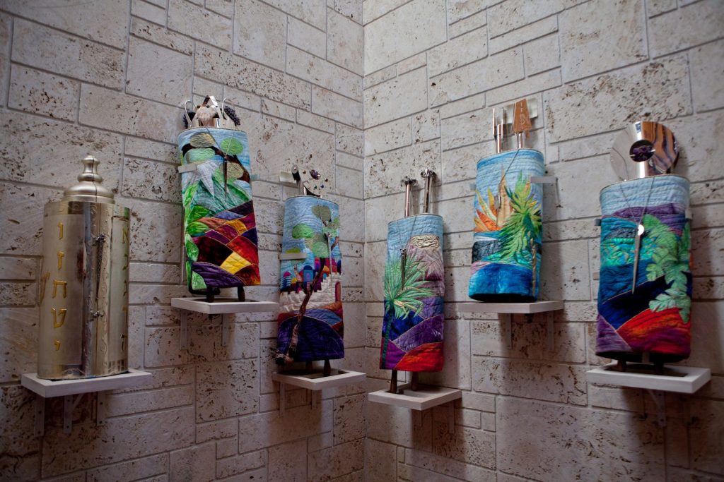 Display cases along a Temple Sinai hallway