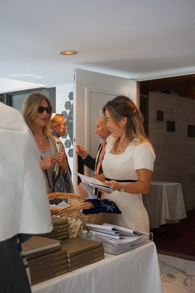 Guests at a celebration in a Temple Sinai event space